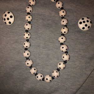 Woman’s polka dot necklace and matching clip on earrings